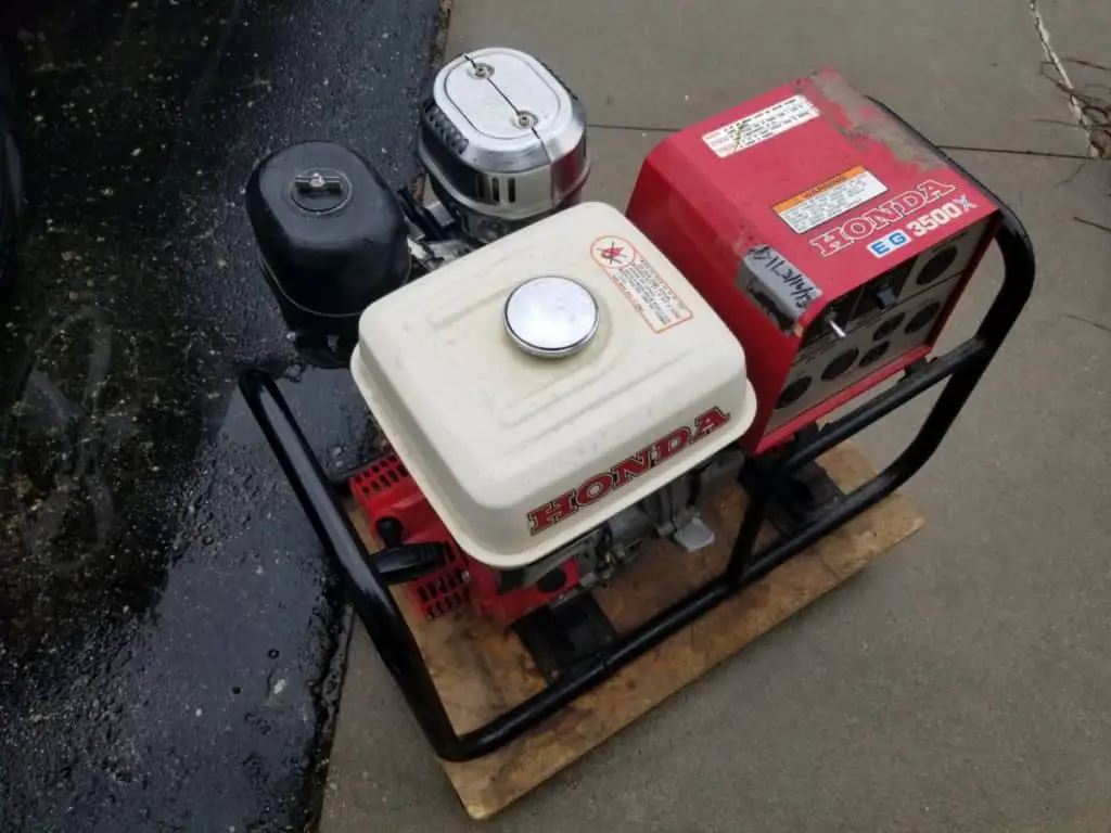 generator sitting outside in the rain