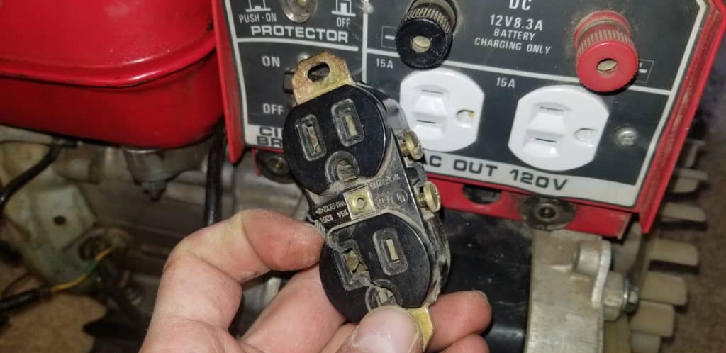 image of a bad outlet on a generator with no power