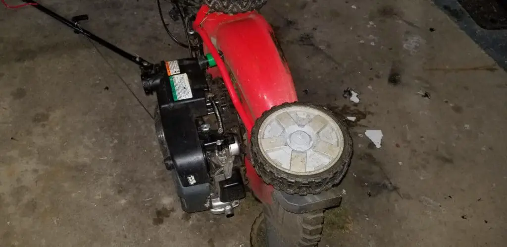 correctly tipping a push mower on its side