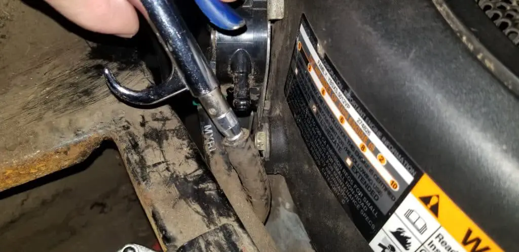 using air compressor to clear out trapped air in riding lawn mower fuel lines