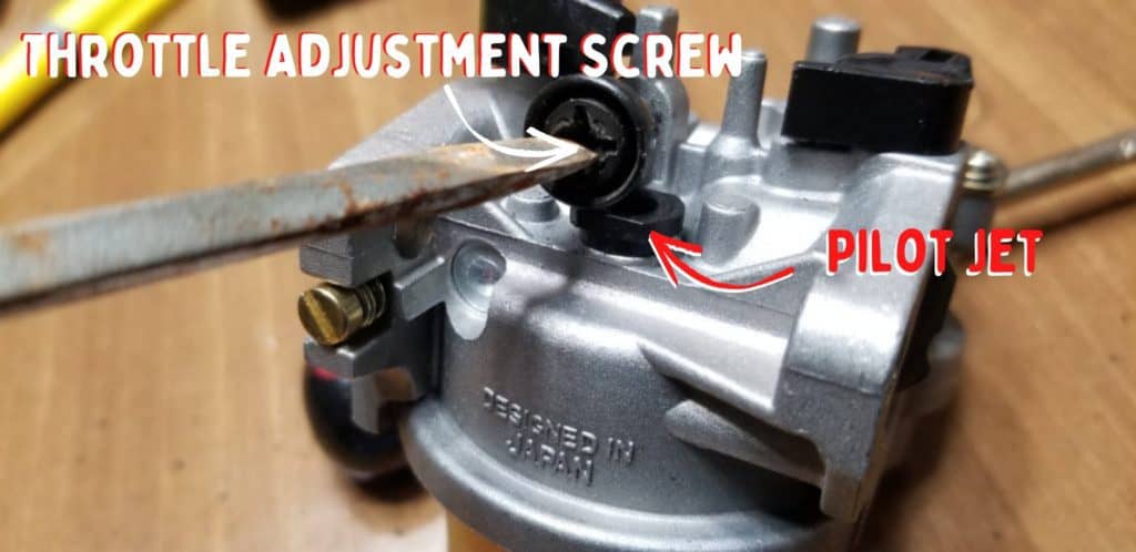 throttle adjustment screw and pilot jet on mower carburetor