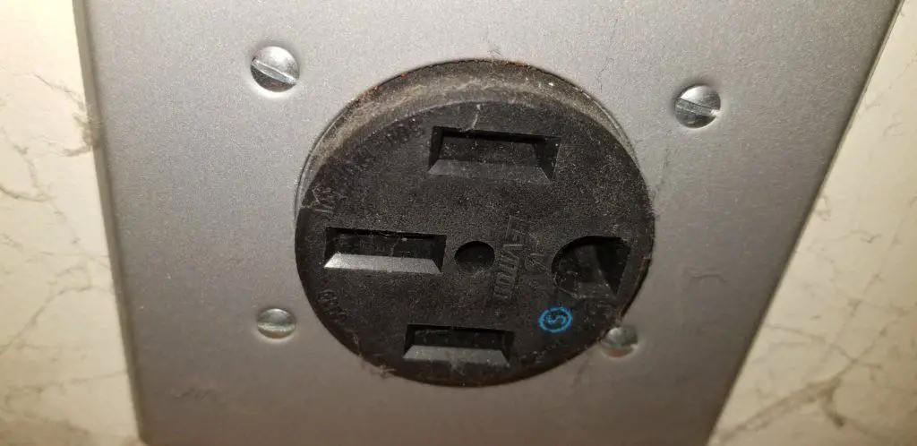 Image of a NEMA 14-50 receptacle that uses 240V for charging an EV at Level 2 speeds.