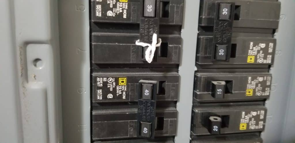 image of a breaker panel with 240V breakers that are us