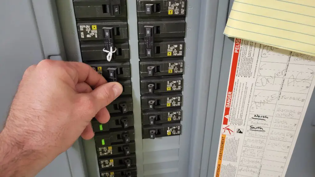 image showing how to turn off and on breakers in the main panel to distribute generator power in a house.