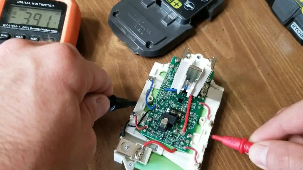 Image showing how to test each of the cells of a Ryobi 18v battery with a multimeter.