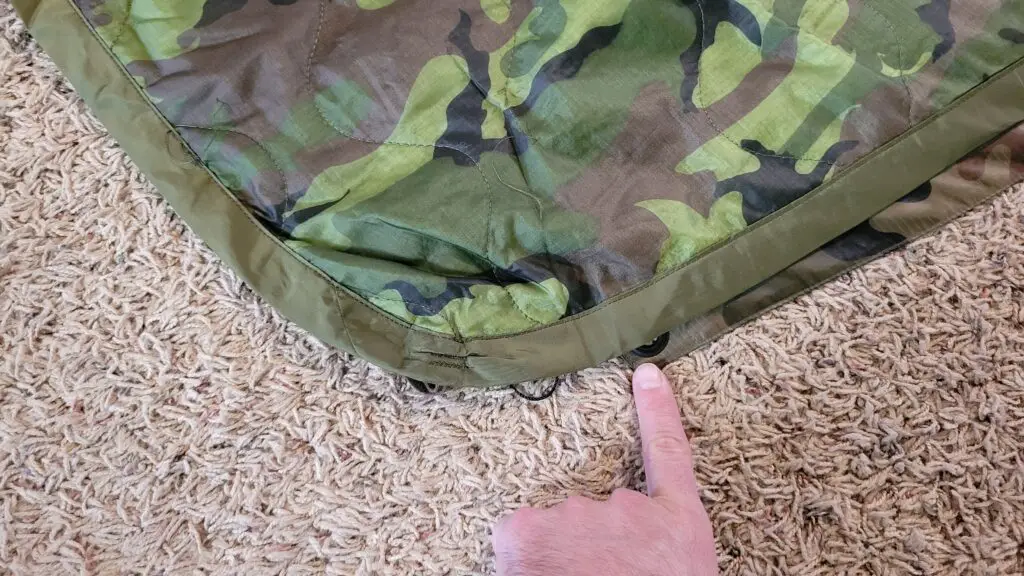 Image showing that a typical poncho liner is much larger than the Helikon Tex poncho.