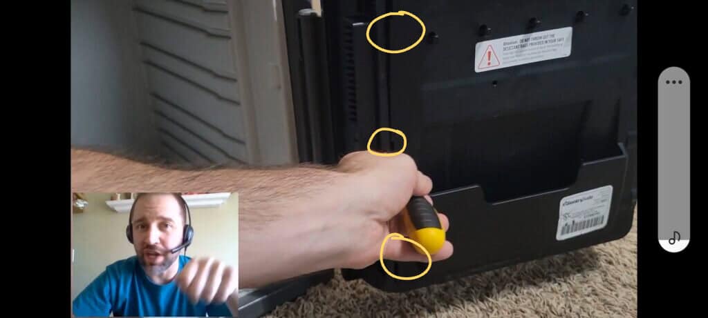 image showing how to reveal the inside panel of a Sentry Safe to access the factory code