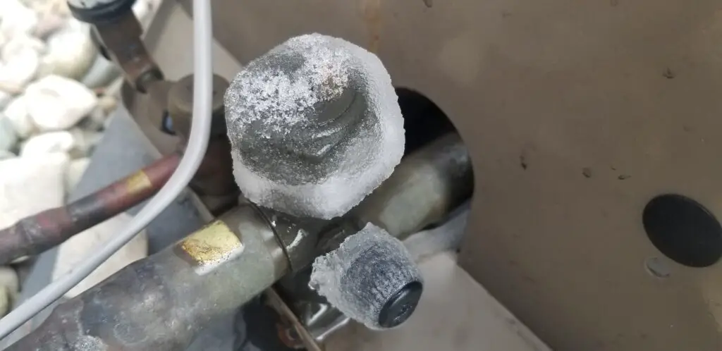 image showing an HVAC freezing at the compressor outside