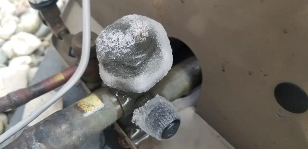 image showing an HVAC freezing at the compressor outside