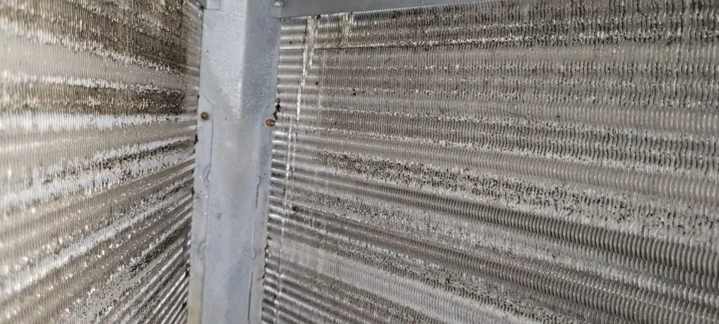 Image of an HVAV evaporator coil with a small amount of dust build up.