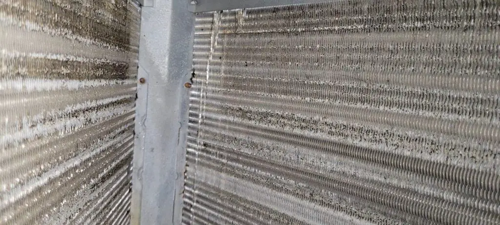 Image of an HVAV evaporator coil with a small amount of dust build up.