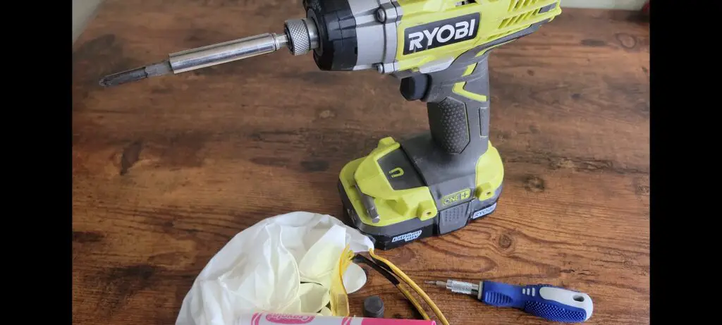 image showing all of the materials and tools needed to fix a ryobi impact driver.