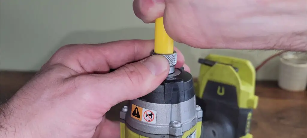 Image showing how to reassemble a ryobi brad nailer after fixing it.
